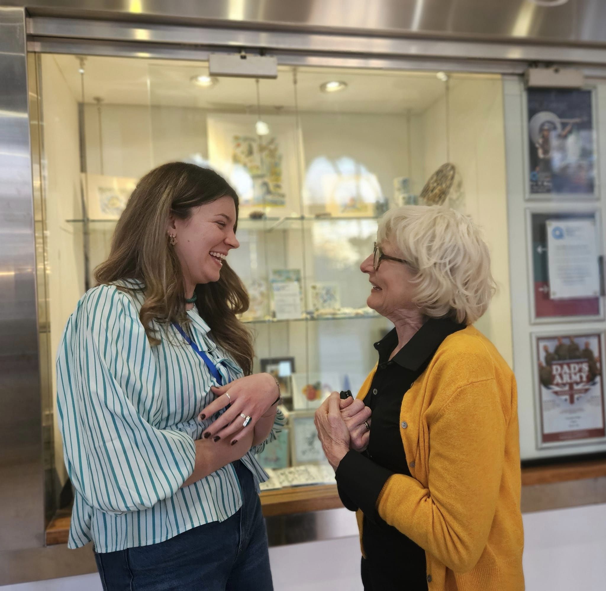 Hexham Book Festival. Two women face one another, talking and laughing